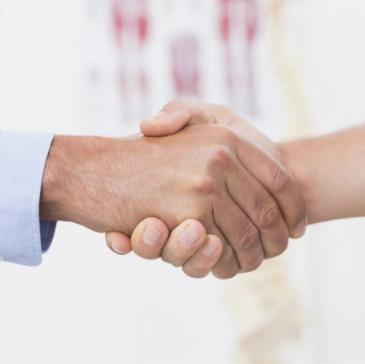 Two people giving handshake