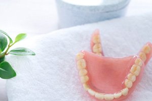 a pair of clean dentures on a towel