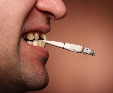 Person biting a cigarette