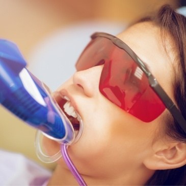 Girl getting fluoride treatment during preventive dentistry visit