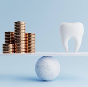 Stacks of coins balanced against tooth