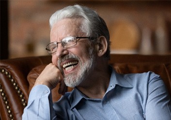 Man with dentures laughing