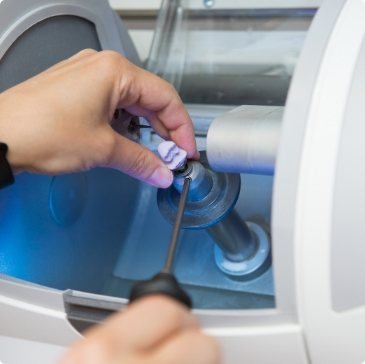 Dental team member creating a CEREC same-day dental crown