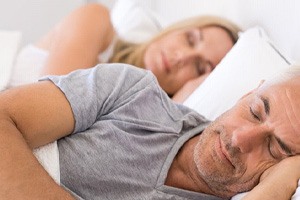 a couple resting in bed together