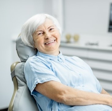 Senior woman smiling in dental chair