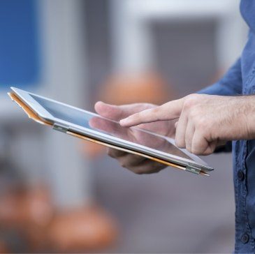 Person typing on tablet