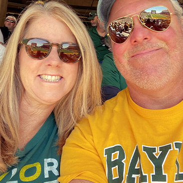 Doctor Cofer and his wife wearing Baylor shirts
