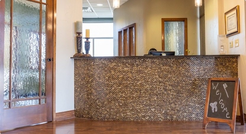 Front desk with welcome sign in Waco dental office
