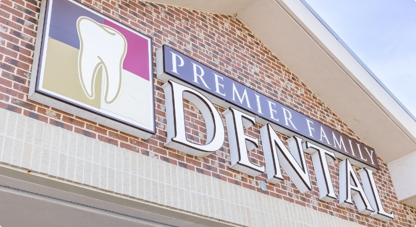 Premier Family Dental sign on the front of dental office building