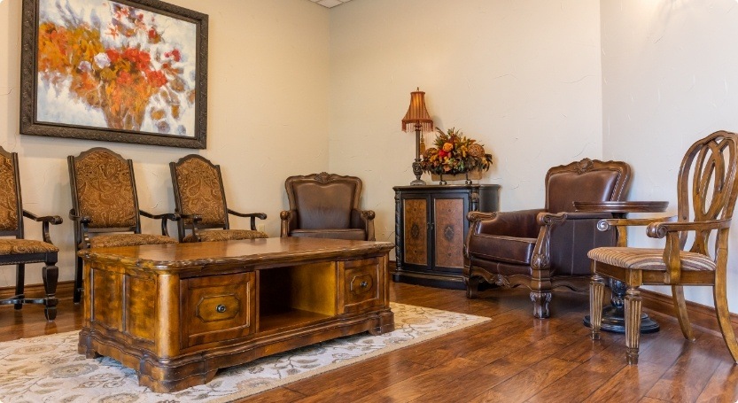 Desk and chairs in waiting room at Premier Family Dental