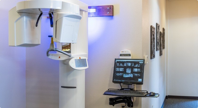 Advanced dental scanner next to computer