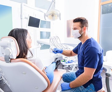 A dentist talking with his patient about oral conscious sedation