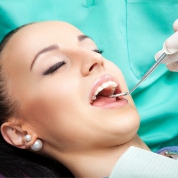 Dental patient opening her mouth for oral cancer screening