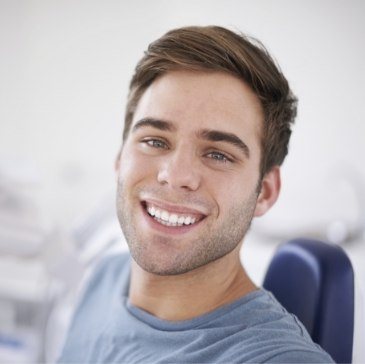 Young man smiling in dental chair