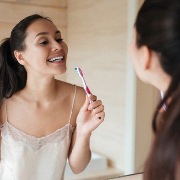 Woman holding a toothbrush