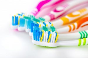 A series of colorful toothbrushes.