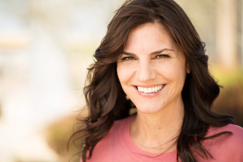 a middle-aged woman smiling 