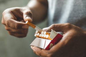 man grabbing a cigarette 