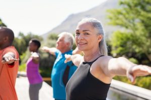 a person doing yoga in the park