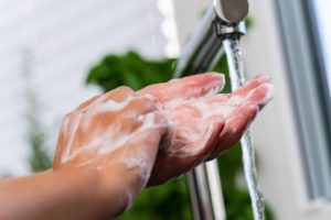 Someone practicing great hand hygiene by washing their hands thoroughly