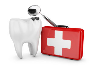white tooth beside red emergency kit
