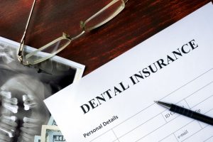 Dental insurance paperwork on a desk.