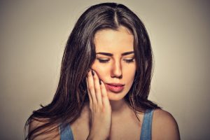 young woman with dental pain