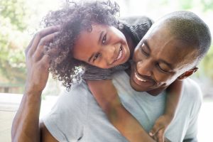 family smiling and laughing