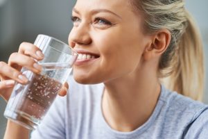 young woman drinking water