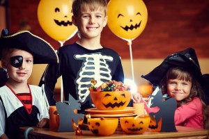 kids smiling with halloween candy ready to visit the family dentist waco loves