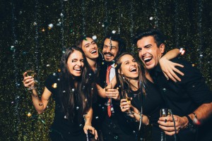 friends with beautiful smiles celebrating the new year with healthy teeth thanks to their dentist in waco