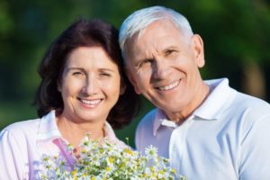 older couple smiling and hugging